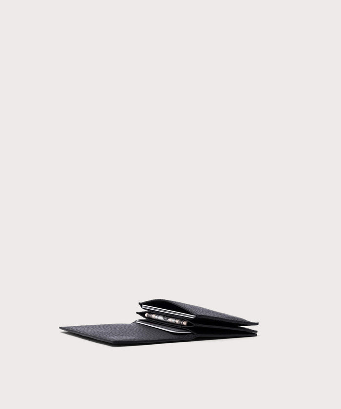 hover - Dagne Dover Accordion Card Case in black opened, revealing the three internal gusseted card slots.