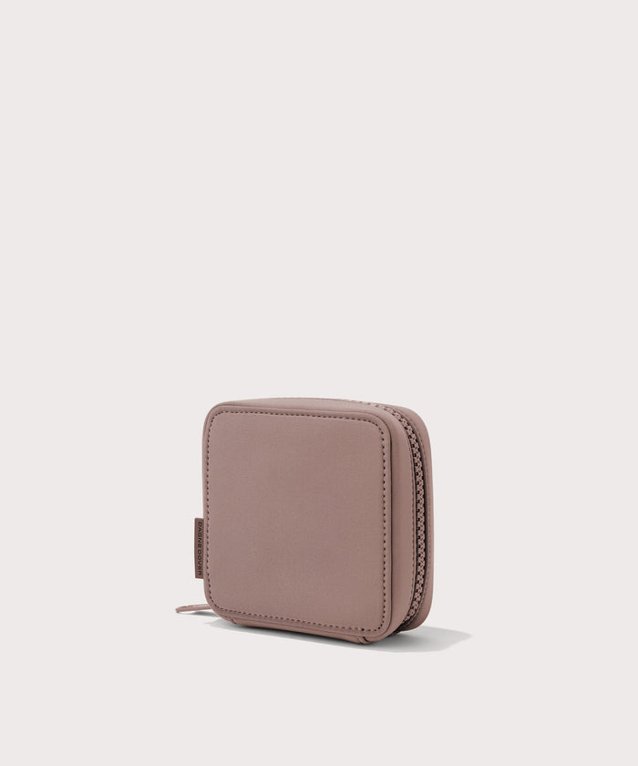 Dagne Dover small Arlo Tech Organizer in pink seen from an angle.