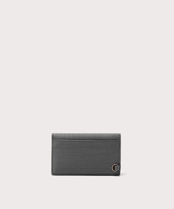 Dagne Dover vegan Card Case in grey seen from the back revealing the one external card slot.