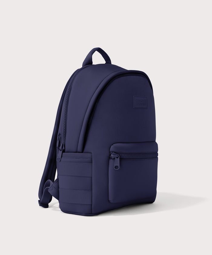 Dagne Dover large Dakota Neoprene Backpack in dark blue seen from an angle.