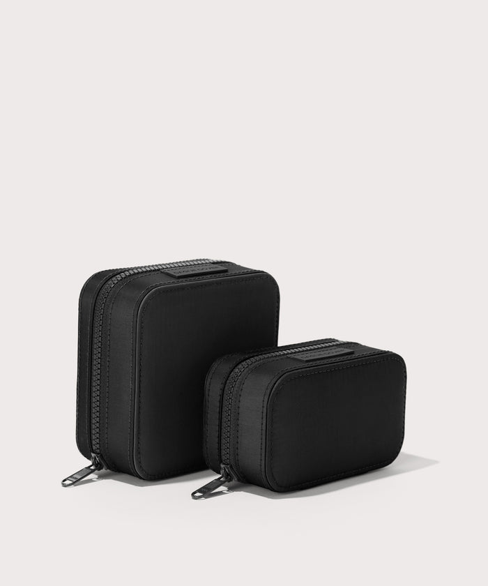 Dagne Dover Small and small Frankie Jewelry Cases in black standing next to one another.