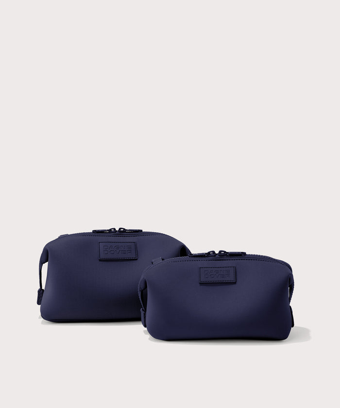 Dagne Dover Small and Large Hunter Toiletry Bags in dark blue.