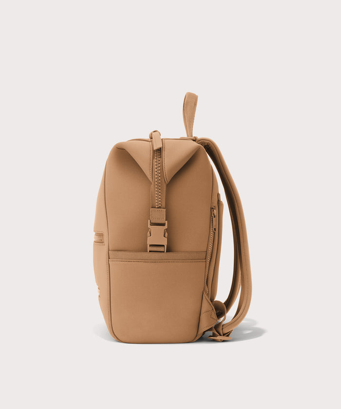 Dagne Dover Medium Indi Diaper Backpack in camel brown seen from the side.