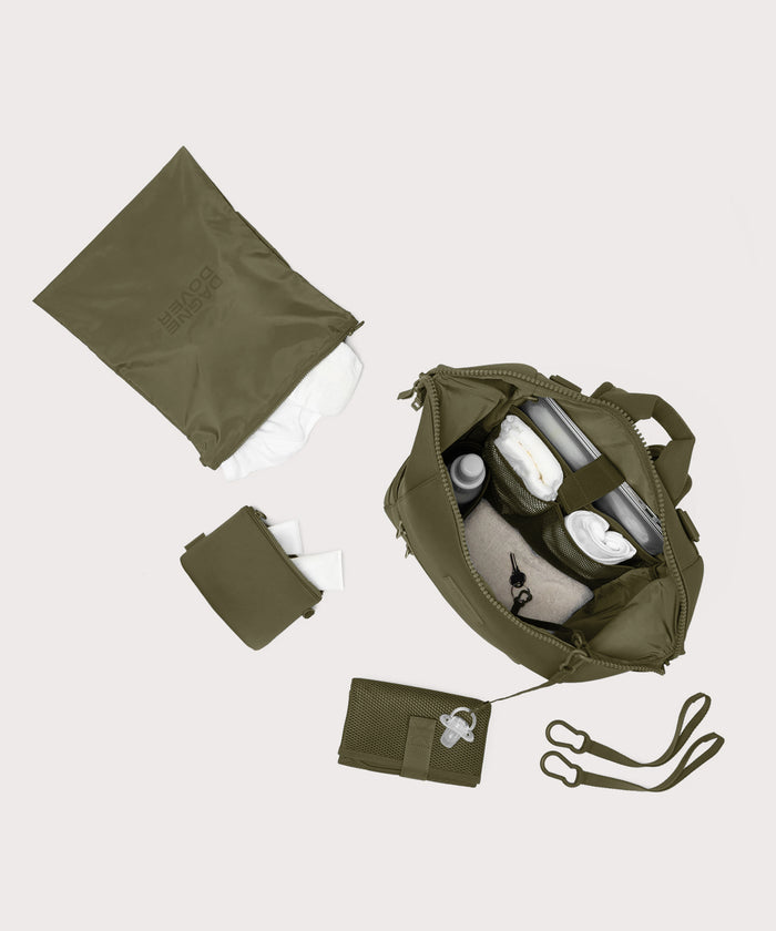 Dagne Dover Large Indi Diaper Backpack in dark moss showing it's water resistant bag, interior pockets, and changing mat.