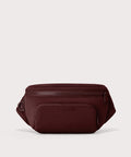 Dagne Dover Jax Large Fanny Pack in a deep brown with purple undertones.