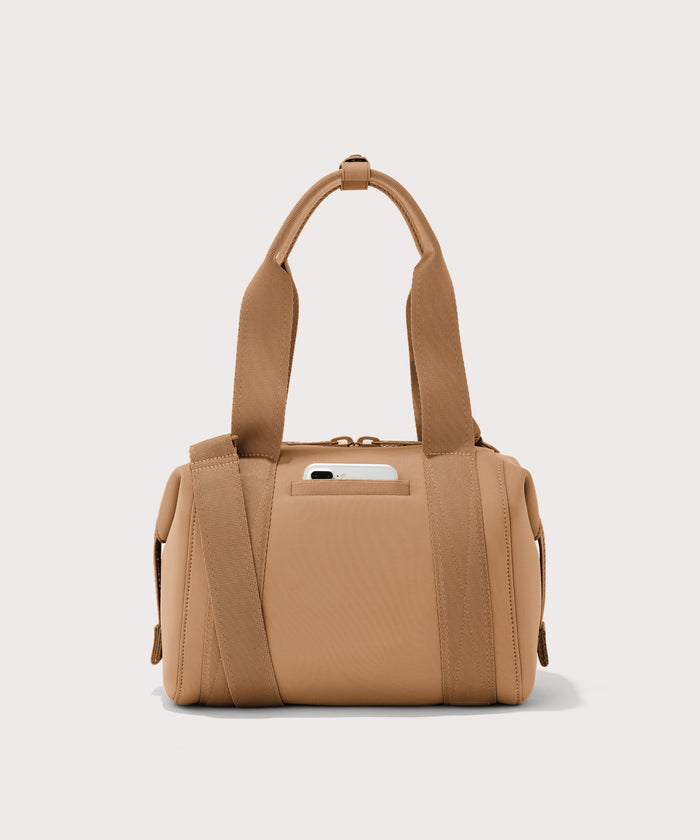 small Landon Carryall in brown camel, displaying an exterior phone pocket