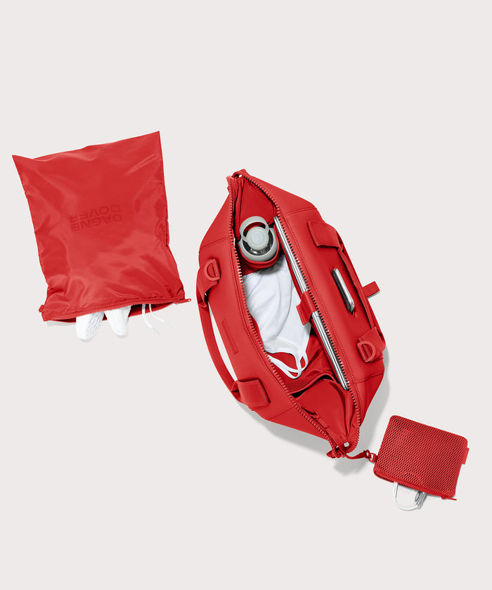 Dagne Dover Medium Landon Carryall in a fiery, saturated red leaning toward orange unzipped, top down view.