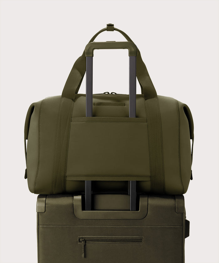 Extra large Landon Carryall in dark green displaying luggage sleeve