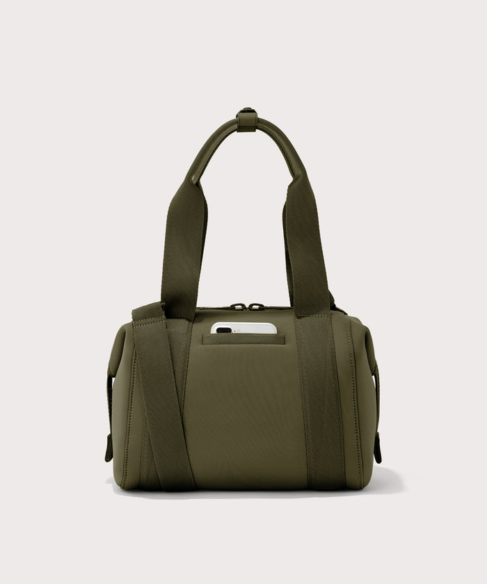 small Landon Carryall in dark green, displaying an exterior phone pocket