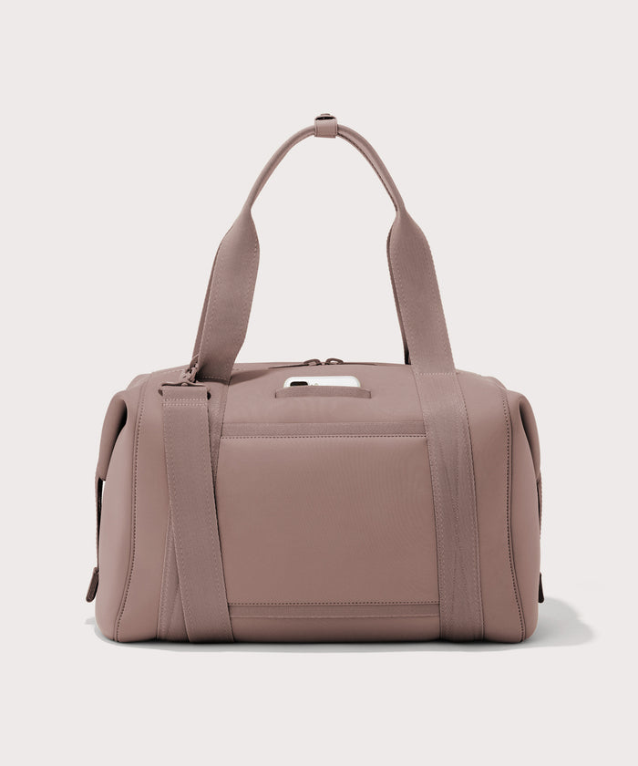 Large Landon Carryall in pink, displaying an exterior phone pocket