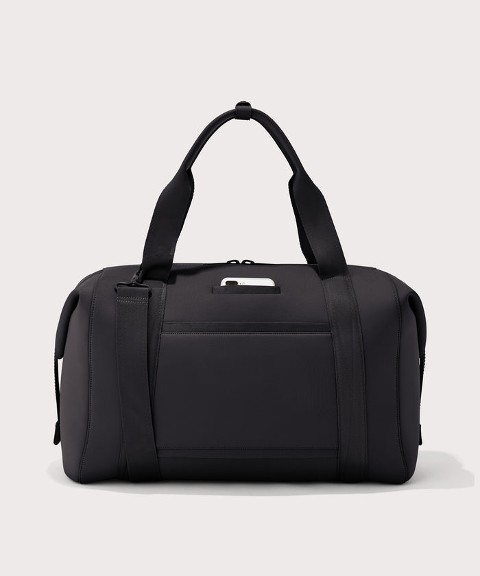 Extra large Landon Carryall in black, displaying an exterior phone pocket