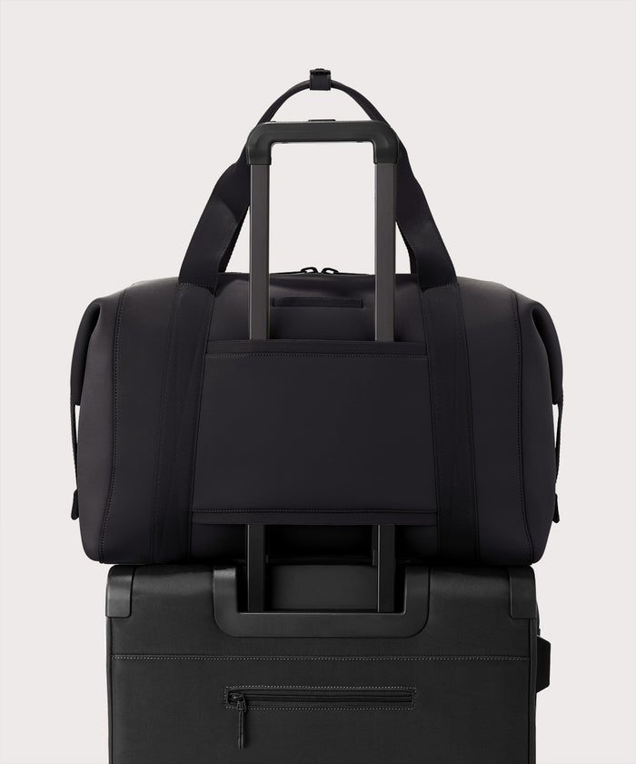 Extra large Landon Carryall in dark green displaying luggage sleeve