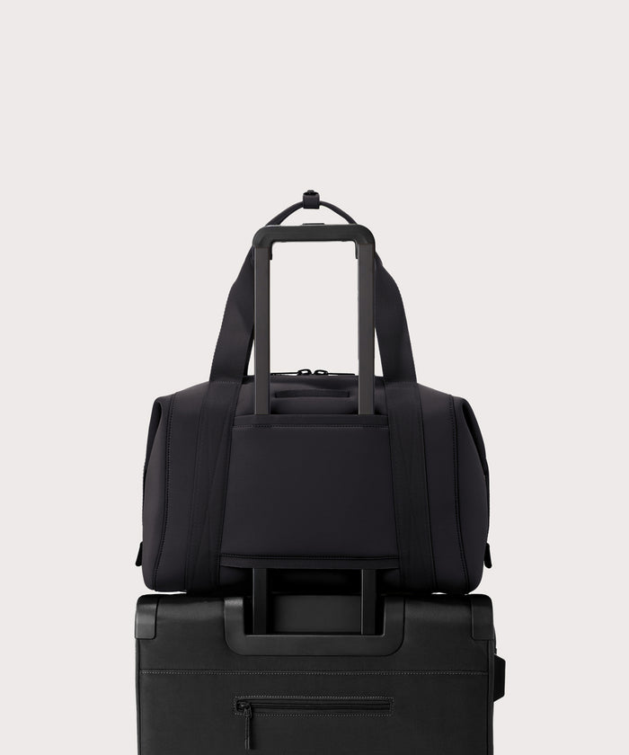 Large Landon Carryall in black displaying luggage sleeve
