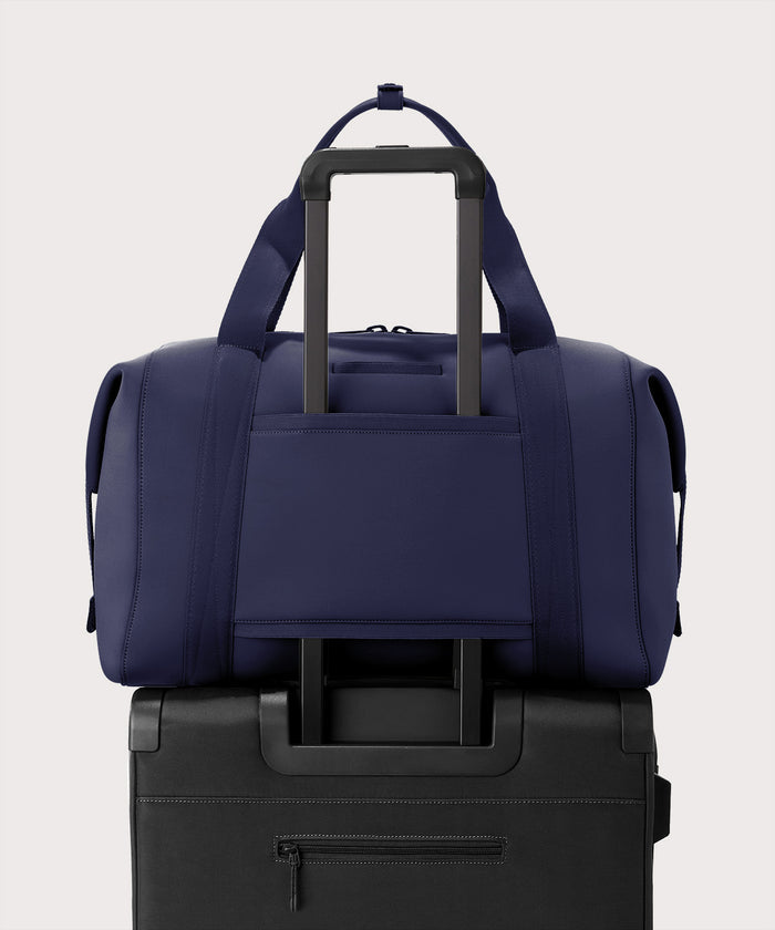 Extra large Landon Carryall in storm displaying luggage sleeve