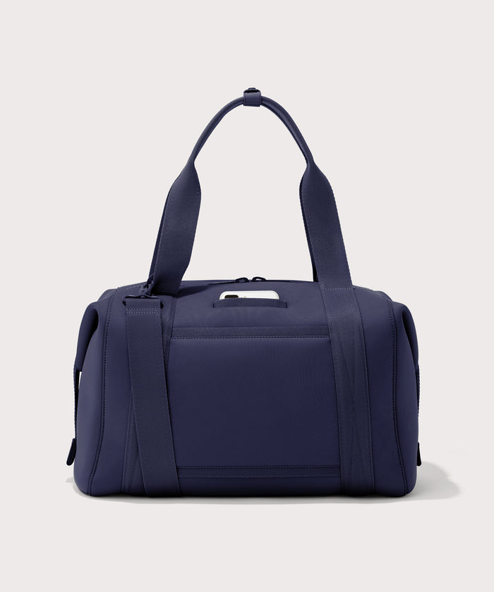 Large Landon Carryall in navy blue, displaying an exterior phone pocket