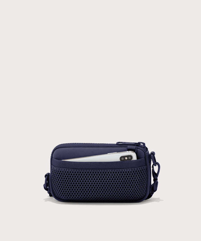 Dagne Dover Mara Phone Sling in dark blue showing the exterior air mesh slip.