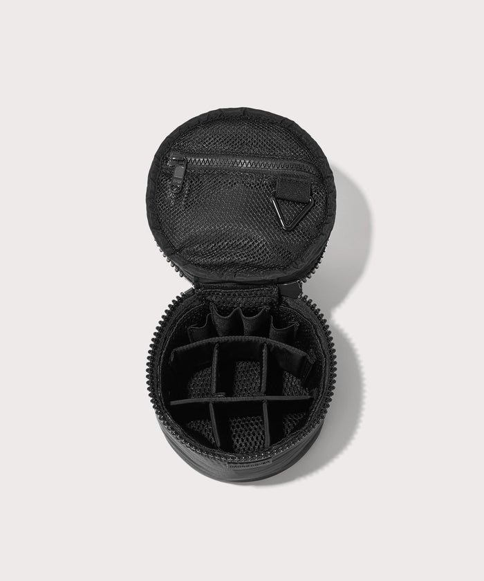 Dagne Dover small Mila Toiletry Pouch in black unzipped with the 6 adjustable compartments.