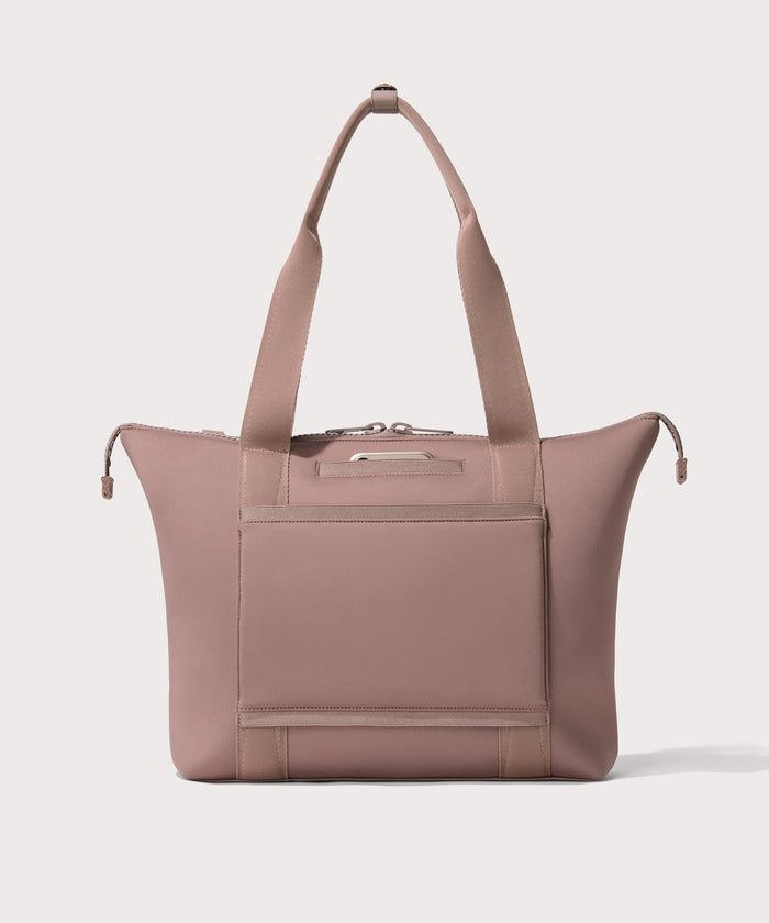 Tote  in a  pink seen from the back view showing phone pocket.