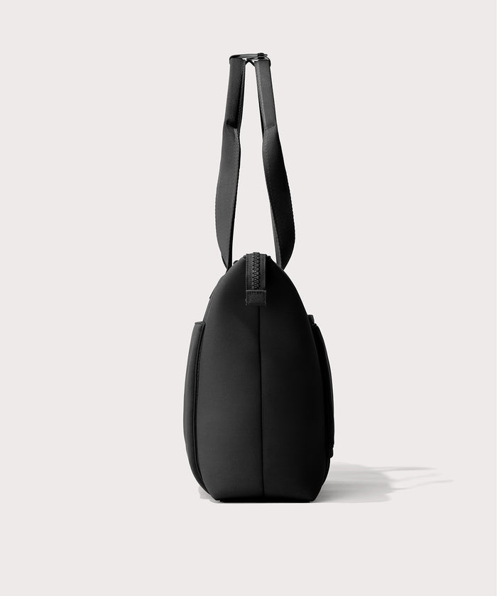 Tote  bag in a  black seen from the side view.