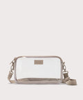 Clear crossbody bag with beige strap on a white background. Stadium compliant.