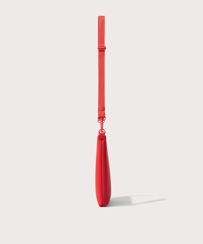 14 inch laptop shoulder bag in a fiery, saturated red leaning toward orange seen from the side view.