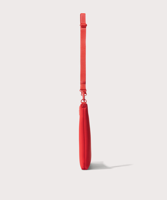 16 inch laptop shoulder bag in a fiery, saturated red leaning toward orange seen from the side view.