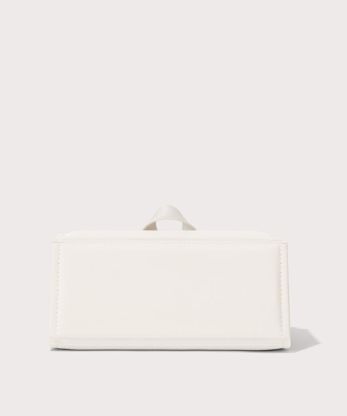 Dagne Dover Remi foldable glasses holder in white seen from the back.