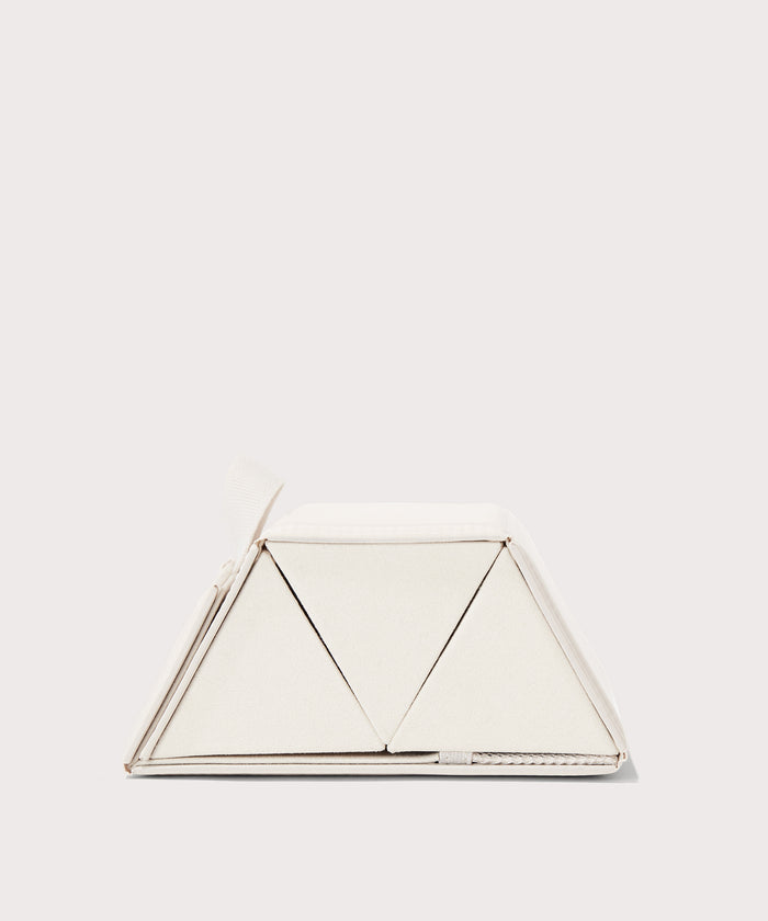 Dagne Dover Remi foldable glasses holder in white seen from the side.