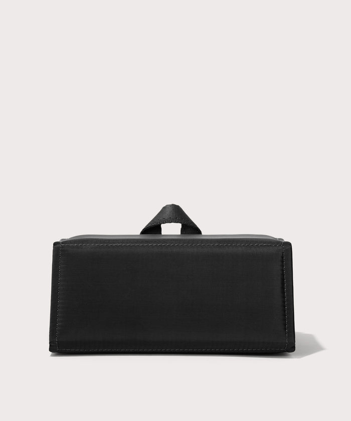 Dagne Dover Remi foldable glasses holder in black seen from the back.