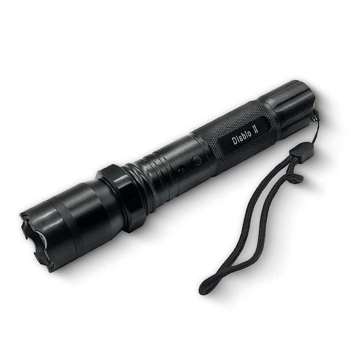 black tactical flashlight stun gun laying down