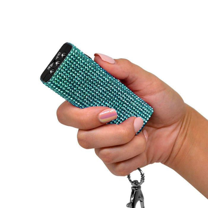 stun gun with rhinestones teal in hand