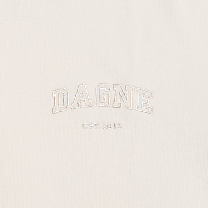 Dagne Dover T-Shirt logo closeup in moonbeam.
